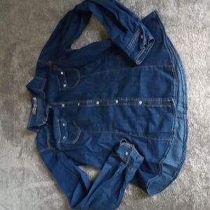 The Hanger Western style denim shirt pearlized snaps missing top snap